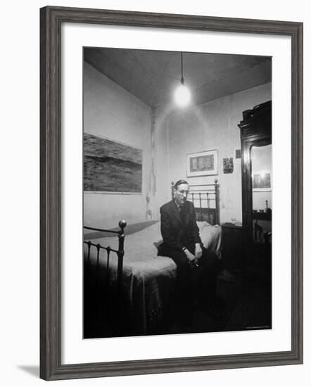 Author William Burroughs, an Ex Dope Addict, Relaxing on a Shabby Bed in a "Beat Hotel"-Loomis Dean-Framed Premium Photographic Print