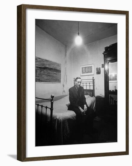 Author William Burroughs, an Ex Dope Addict, Relaxing on a Shabby Bed in a "Beat Hotel"-Loomis Dean-Framed Premium Photographic Print