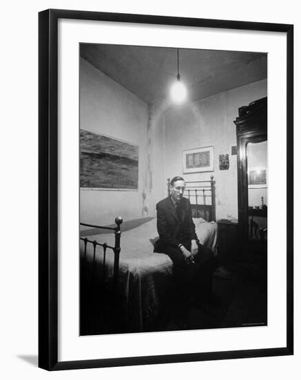 Author William Burroughs, an Ex Dope Addict, Relaxing on a Shabby Bed in a "Beat Hotel"-Loomis Dean-Framed Premium Photographic Print