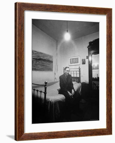 Author William Burroughs, an Ex Dope Addict, Relaxing on a Shabby Bed in a "Beat Hotel"-Loomis Dean-Framed Premium Photographic Print