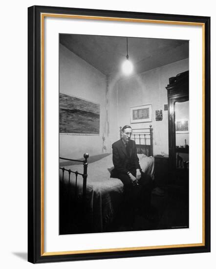 Author William Burroughs, an Ex Dope Addict, Relaxing on a Shabby Bed in a "Beat Hotel"-Loomis Dean-Framed Premium Photographic Print