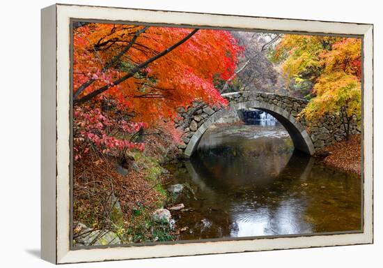 Autumn color and old stone arched bridge at Namsangol traditional folk village, Seoul, South Korea-null-Framed Premier Image Canvas