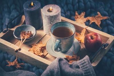 https://imgc.artprintimages.com/img/print/autumn-mood-concept-warm-cozy-and-rustic-still-life-with-cup-of-tea-candle-and-pumpkins_u-l-q1rwcps0.jpg?artPerspective=n