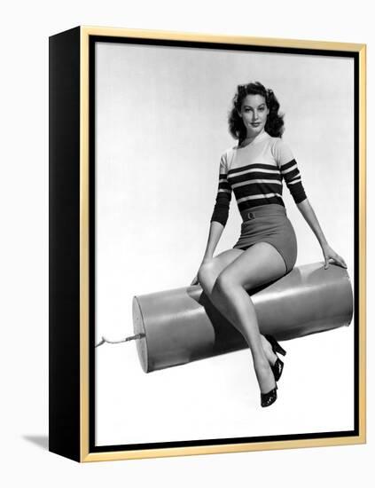 Ava Gardner seated on Giant firecracker, c. 1945 (b/w photo)-null-Framed Stretched Canvas