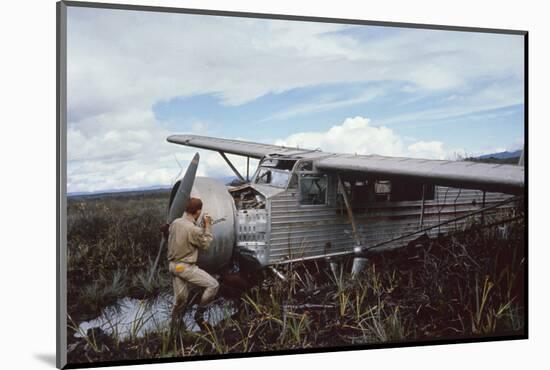 Aviator Roland Angel Repaints His Father's Flamingo Monoplane, Auyantepui, Venezuela, 1965-Carl Mydans-Mounted Photographic Print