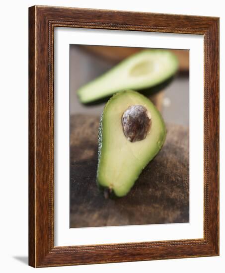 Avocado, Halved, on Old Chopping Board-Jo Kirchherr-Framed Photographic Print