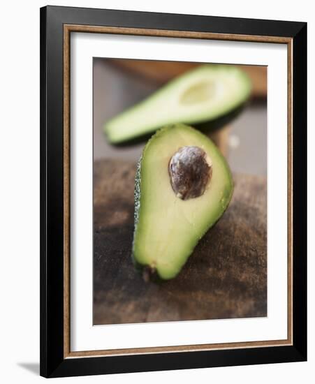 Avocado, Halved, on Old Chopping Board-Jo Kirchherr-Framed Photographic Print