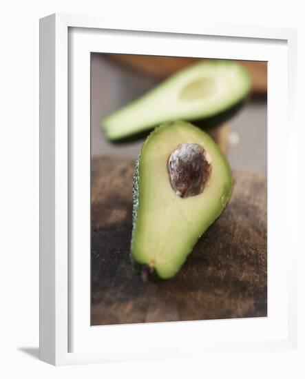 Avocado, Halved, on Old Chopping Board-Jo Kirchherr-Framed Photographic Print