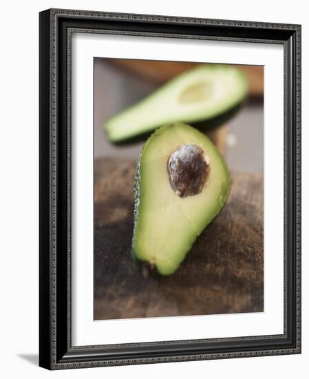 Avocado, Halved, on Old Chopping Board-Jo Kirchherr-Framed Photographic Print