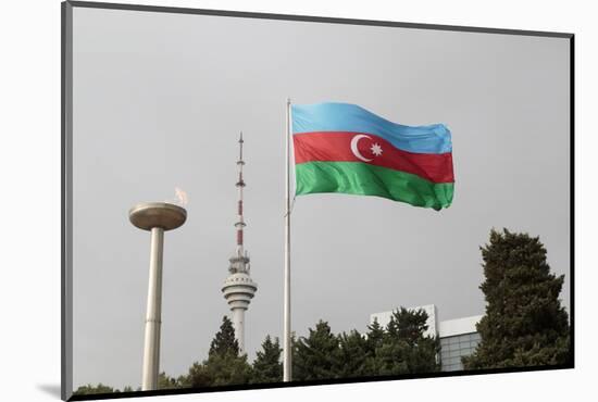 Azerbaijan, Baku. an Azerbaijan Flag Waves Near a Memorial Flame and the Baku Tv Tower-Alida Latham-Mounted Photographic Print