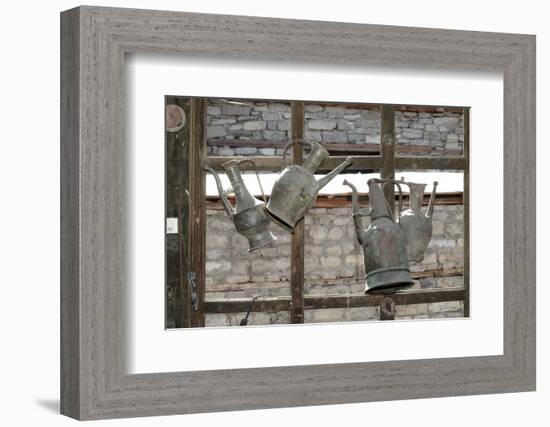 Azerbaijan, Lahic. Antique kettles hanging on the inside of a window.-Alida Latham-Framed Photographic Print