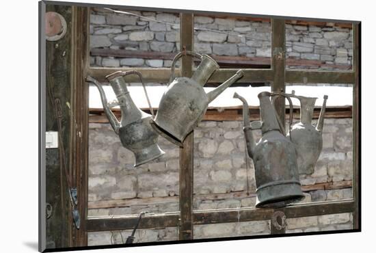 Azerbaijan, Lahic. Antique kettles hanging on the inside of a window.-Alida Latham-Mounted Photographic Print
