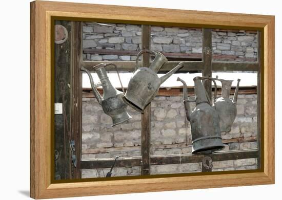 Azerbaijan, Lahic. Antique kettles hanging on the inside of a window.-Alida Latham-Framed Premier Image Canvas