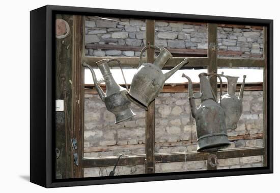 Azerbaijan, Lahic. Antique kettles hanging on the inside of a window.-Alida Latham-Framed Premier Image Canvas