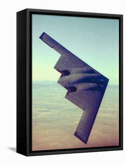 B-2 Stealth Bomber Flying over Desert-Like Landscape-null-Framed Premier Image Canvas