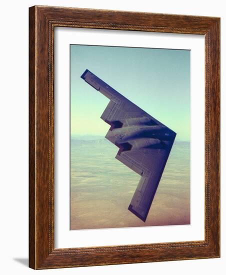 B-2 Stealth Bomber Flying over Desert-Like Landscape-null-Framed Premium Photographic Print