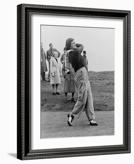 Babe Didrikson, Watching Golf Ball as She Completes Her Swing-null-Framed Photo