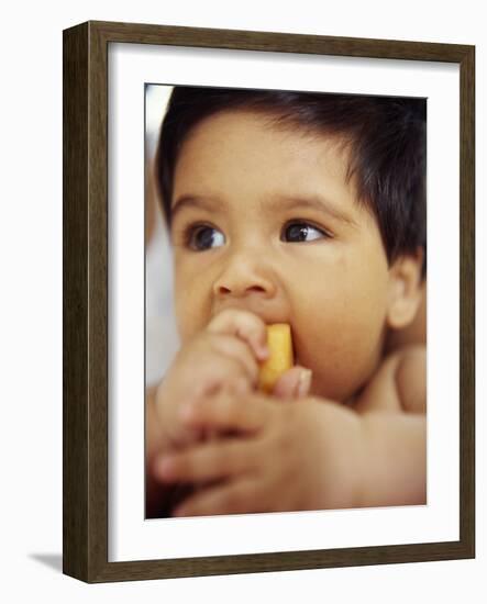 Baby Boy Eating-Ian Boddy-Framed Photographic Print