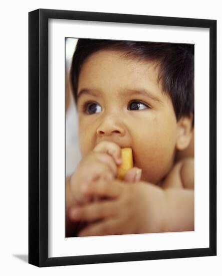 Baby Boy Eating-Ian Boddy-Framed Photographic Print