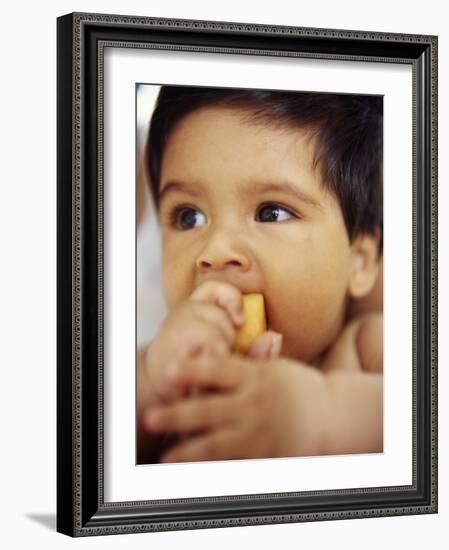 Baby Boy Eating-Ian Boddy-Framed Photographic Print