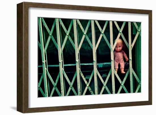 Baby Doll Through Security Fence NYC-null-Framed Photo