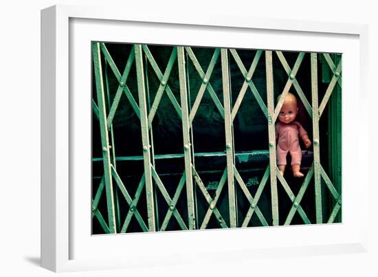 Baby Doll Through Security Fence NYC-null-Framed Photo