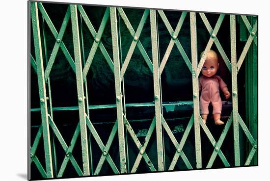 Baby Doll Through Security Fence NYC-null-Mounted Photo