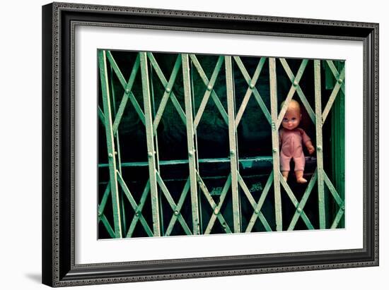 Baby Doll Through Security Fence NYC-null-Framed Photo