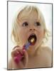 Baby Girl Brushing Teeth-Ian Boddy-Mounted Photographic Print