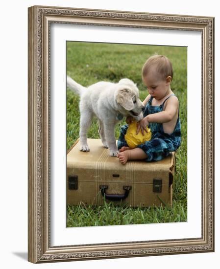 Baby Girl Playing with Puppy-Chris Lowe-Framed Photographic Print