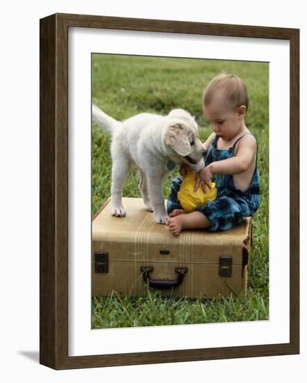 Baby Girl Playing with Puppy-Chris Lowe-Framed Photographic Print