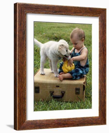 Baby Girl Playing with Puppy-Chris Lowe-Framed Photographic Print