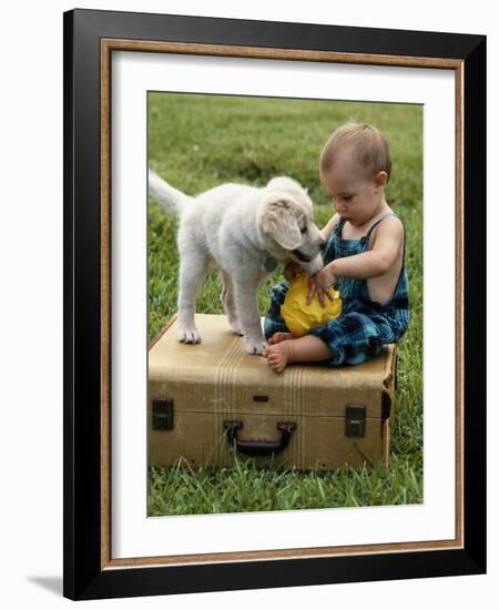 Baby Girl Playing with Puppy-Chris Lowe-Framed Photographic Print