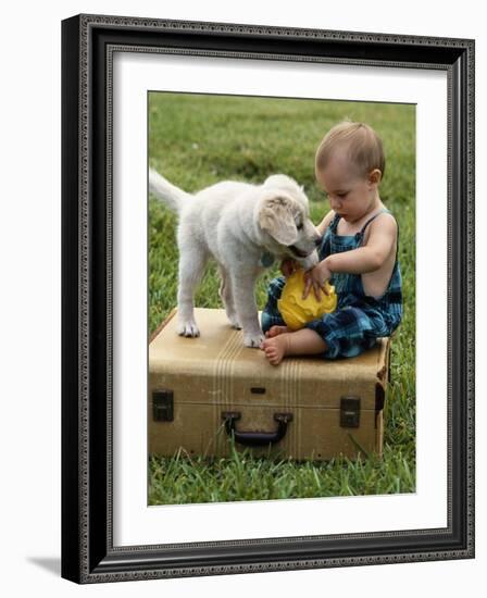 Baby Girl Playing with Puppy-Chris Lowe-Framed Photographic Print