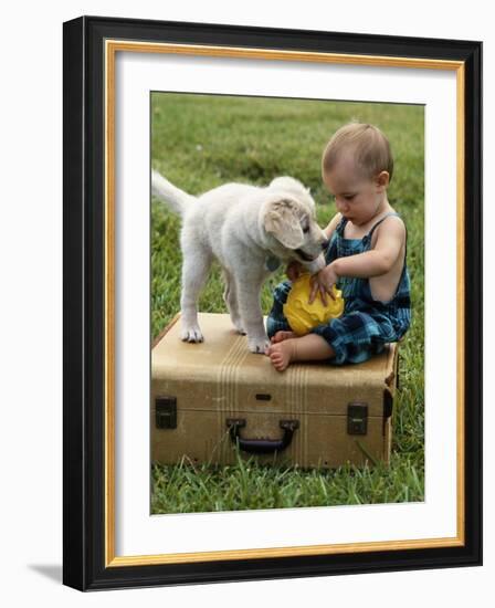 Baby Girl Playing with Puppy-Chris Lowe-Framed Photographic Print