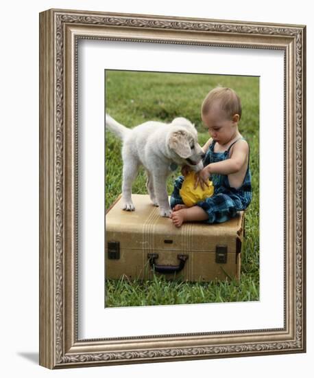 Baby Girl Playing with Puppy-Chris Lowe-Framed Photographic Print