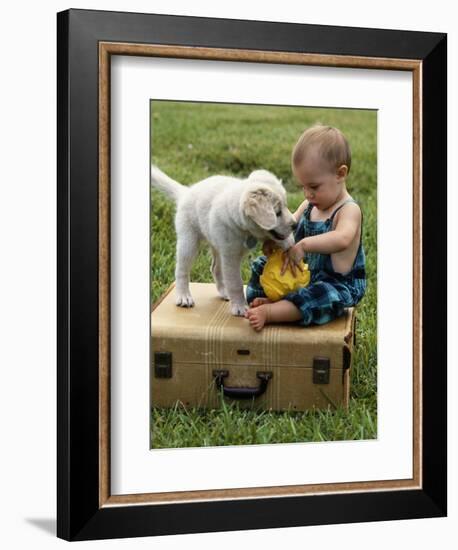 Baby Girl Playing with Puppy-Chris Lowe-Framed Photographic Print