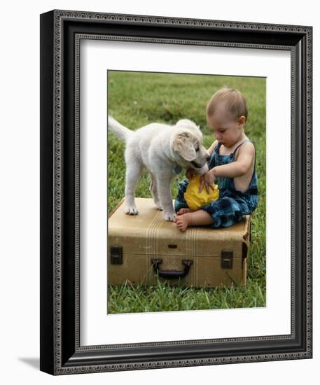 Baby Girl Playing with Puppy-Chris Lowe-Framed Photographic Print