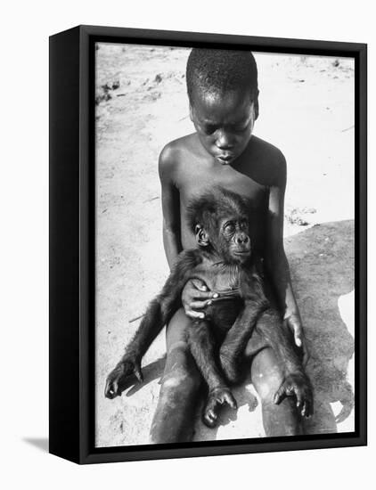 Baby Gorilla Named Bobo is Being Held by a Local Youngster-Eliot Elisofon-Framed Premier Image Canvas