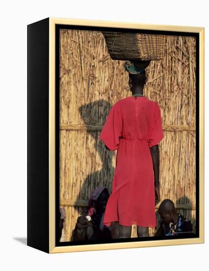Back View of a Nuer Woman Carrying a Wicker Cradle or Crib on Her Head, Ilubador State, Ethiopia-Bruno Barbier-Framed Premier Image Canvas