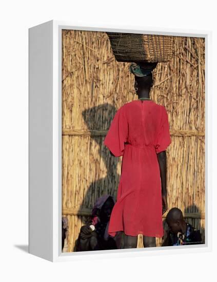 Back View of a Nuer Woman Carrying a Wicker Cradle or Crib on Her Head, Ilubador State, Ethiopia-Bruno Barbier-Framed Premier Image Canvas