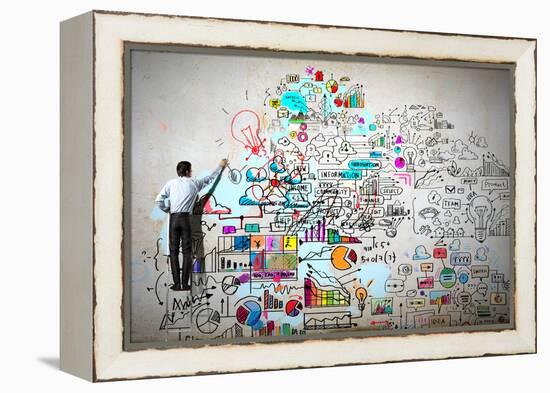 Back View of Businessman Drawing Sketch on Wall-Sergey Nivens-Framed Premier Image Canvas