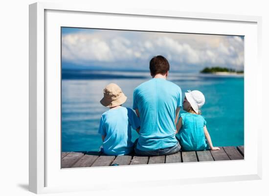 Back View of Father and Kids Sitting on Wooden Dock Looking to Ocean-BlueOrange Studio-Framed Photographic Print