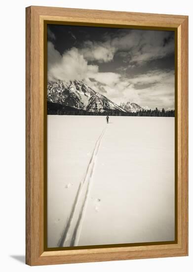 Backcountry skier under Mount Moran, Grand Teton National Park, Wyoming, USA-Russ Bishop-Framed Premier Image Canvas