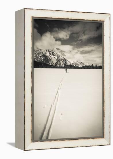 Backcountry skier under Mount Moran, Grand Teton National Park, Wyoming, USA-Russ Bishop-Framed Premier Image Canvas