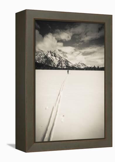 Backcountry skier under Mount Moran, Grand Teton National Park, Wyoming, USA-Russ Bishop-Framed Premier Image Canvas