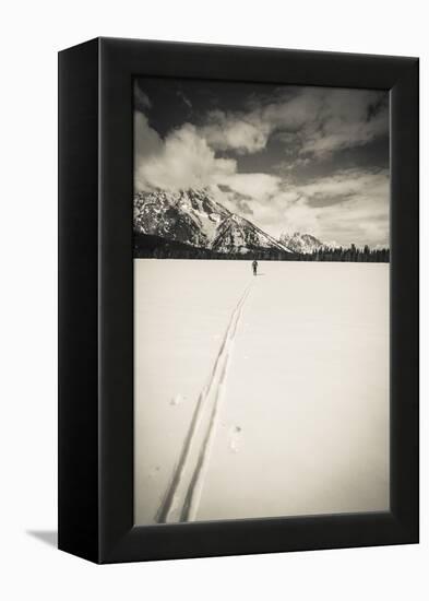 Backcountry skier under Mount Moran, Grand Teton National Park, Wyoming, USA-Russ Bishop-Framed Premier Image Canvas