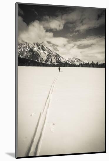 Backcountry skier under Mount Moran, Grand Teton National Park, Wyoming, USA-Russ Bishop-Mounted Photographic Print