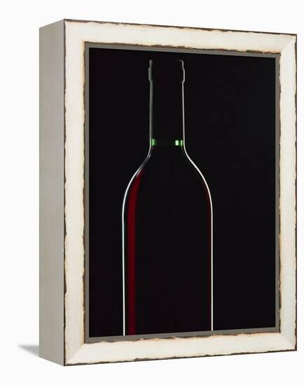 Backlit Shot of a Bottle of Red Wine-Lee Frost-Framed Premier Image Canvas