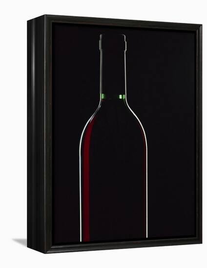 Backlit Shot of a Bottle of Red Wine-Lee Frost-Framed Premier Image Canvas